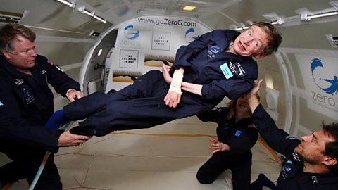 Hawking celebrating his 65th birthday with a trip in NASA's zero gravity plane.