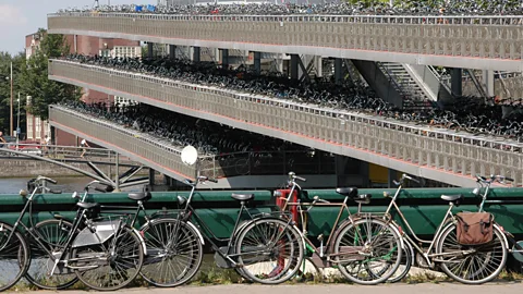 Airbete/Wikipedia/CC BY-SA 3.0 Dutch cities such as Amsterdam have huge parking buildings for bicycles (Credit: Airbete/Wikipedia/CC BY-SA 3.0)