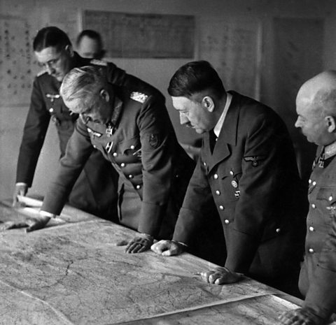Adolf Hitler looking at a map and planning the offensive on Stalingrad