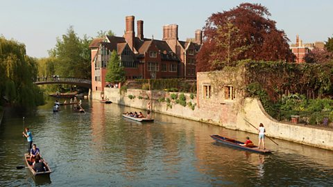 A scene of punting on a river in Cambridge