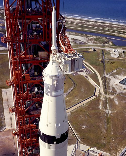 Technicians working on the Saturn V before launch.