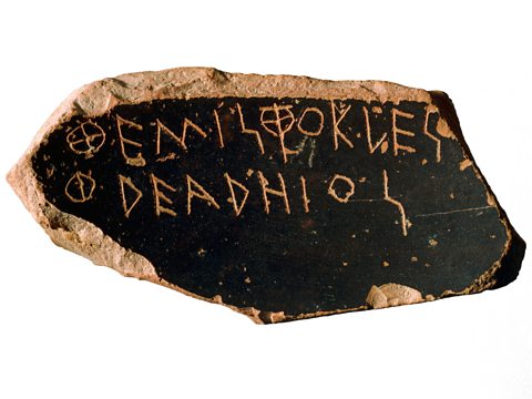 An ancient ostracon with the name 'Themistocles' written on it. 