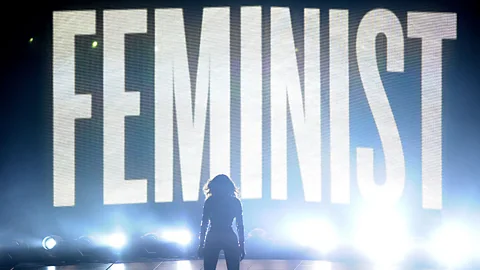 Jason LaVeris/FilmMagic Though she is comfortable embracing traditional domestic roles, Beyoncé also imbues her songs and performances with powerful feminist themes (Credit: Jason LaVeris/FilmMagic)