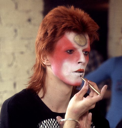 This 1973 photo shows David Bowie mid-makeup