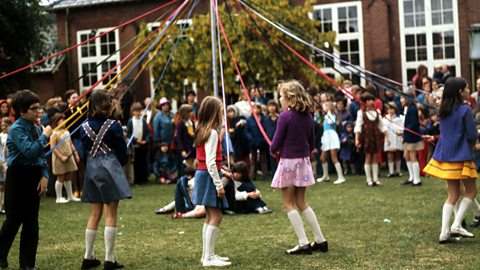 Focus image: a picture of traditional maypole dancing at a school fete in the 1970’s