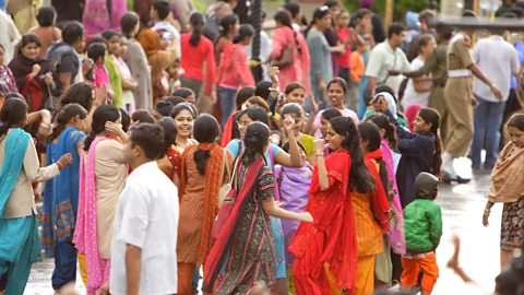 Department of Foreign Affairs and Trade/Flickr/CC BY-SA 2.0 Excited spectators gather at the ceremony site (Credit: Department of Foreign Affairs and Trade/Flickr/CC BY-SA 2.0)