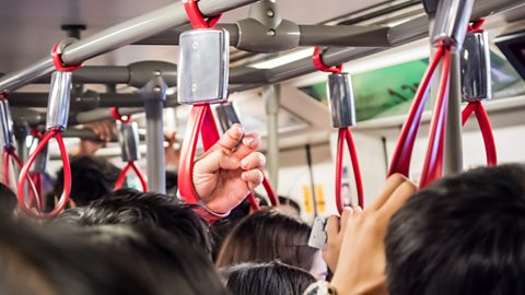 Focus image: people on a crowded train