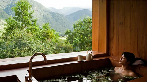 Como Hotels and Resorts Unwinding in one of Bhutan's hot stone baths (Credit: Como Hotels and Resorts)