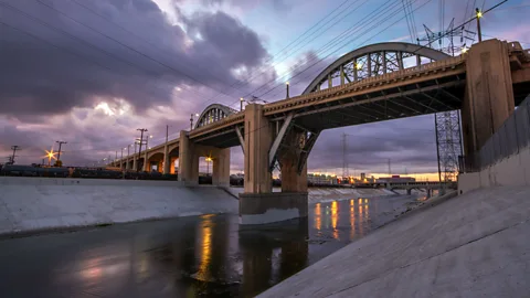 Shabdro Photo/Getty Admiring the sunrise under a bridge across the LA river (Credit: Shabdro Photo/Getty)