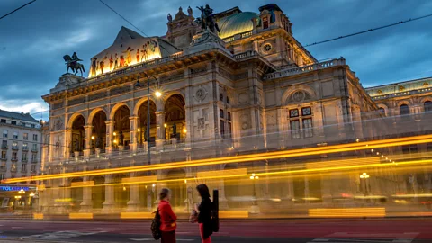Joe Klamar/AFP/Getty Images A tram passes in front of the Wiener Staatsoper, Vienna's State Opera (Credit: Joe Klamar/AFP/Getty Images)
