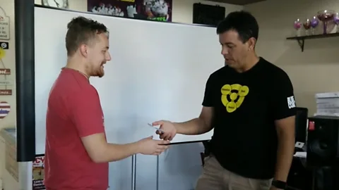 Seth Wahle (left) tests his implant with Rod Soto