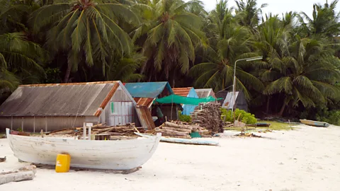 Diane Selkirk Boat building sheds along the beach (Credit: Diane Selkirk)