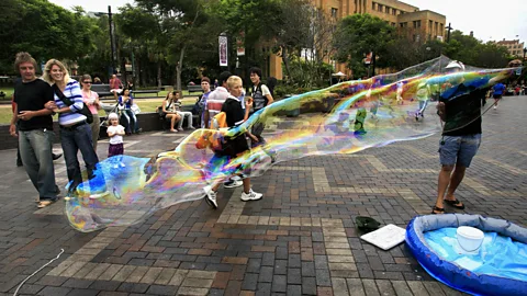 David Hancock/Getty Making bubbles in Sydney's Circular Quay (Credit: David Hancock/Getty)