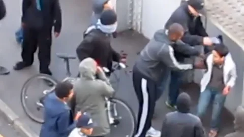REX Shutterstock Malaysian student Ashraf Haziq is mugged by youths at London's 2011 riots (Credit: REX Shutterstock)