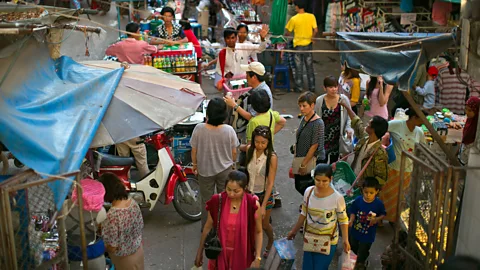 Paula Bronstein/Getty Images Shoppers in the Burmese border town of Tachileik (Credit: Paula Bronstein/Getty Images)