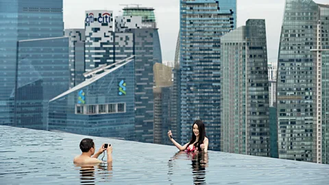 Roslan Rahman/Getty Images iring Singapore's skyline (Credit: Roslan Rahman/Getty Images)