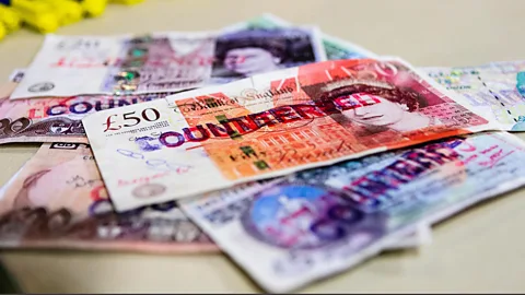 Stephen Barnes/Finance/Alamy A pile of counterfeit Bank of England and Bank of Ireland notes (Credit: Stephen Barnes/Finance/Alamy)