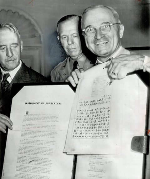 President Truman pointing to Hirohito's signature, authorising Japan's surrender