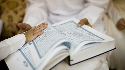 A photo of children holding the Koran