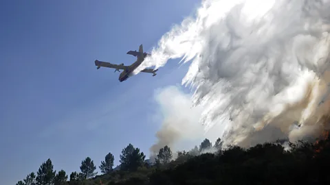 AFP/Getty Images Flying aircraft into turbulent air wreathed by smoke requires great skill (Credit: AFP/Getty Images)