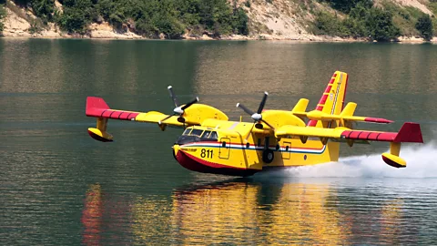 AFP/Getty Images 'Water bombers' like the Canadair CL 415 don't need to use long runways or supplies of retardant chemicals (Credit: AFP/Getty Images)