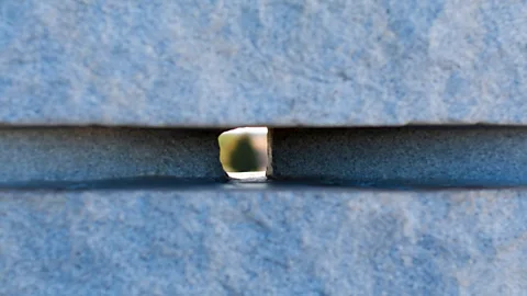 Counse/Georgia Guidestones/Flickr/CC BY 2.0 Looking through the hole that aligns with the heavenly bodies (Credit: Counse/Georgia Guidestones/Flickr/CC BY 2.0)