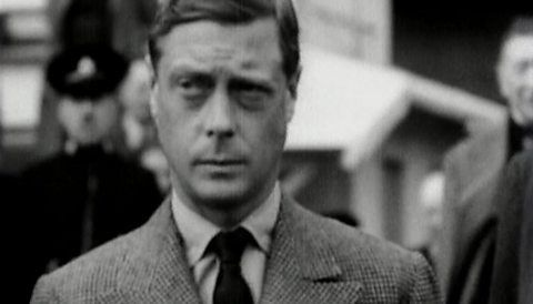 A black and white still image of Edward VIII wearing a suit.