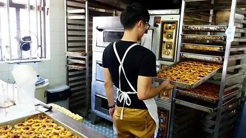 Kate Springer Prepping egg custard tarts for customers (Credit: Kate Springer)