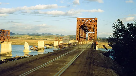 Smith Collection/Gado/Getty Images Freedom Gate railroad bridge links South Korea with the DMZ, which is perilous to cross but has become an unintended nature preserve (Credit: Smith Collection/Gado/Getty Images)