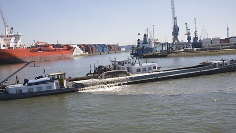 A dredger working to deepen the channel of the River Maas, Port of Rotterdam, Netherlands