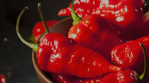 Thinkstock Hot chillis can trigger pleasurable responses... eventually (Credit: Thinkstock)