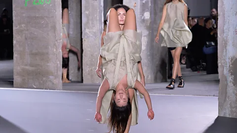 Françios Durand/Getty Images Rick Owens trussed his models together or hung them from one another in an intriguing collection about the bonds between women (Credit: Françios Durand/Getty Images)