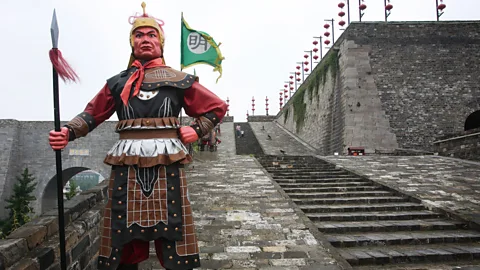 China Photos/Getty A warrior sculpture stands atop the Zhonghua Gate (Credit: China Photos/Getty)