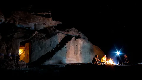Will Jehring Flames flicker in the desert darkness (Credit: Will Jehring)