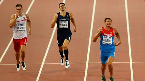 Athletes showing signs of fatigue and pain towards the end of a 400 m race