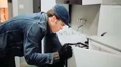 DFF In the episode The King Kong Flu, the spy Alexander breaks into an apartment where he discovers a suspicious suitcase hidden in the freezer (Credit: DFF)