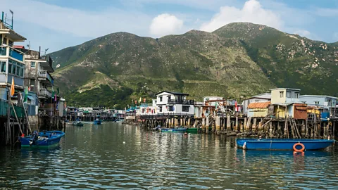 Ostill/iStock The Tai O fishing village is known for operating unregulated dolphin tours (Credit: Ostill/iStock)