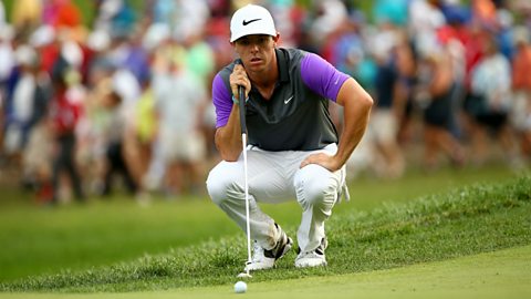 Golfer Rory McIlroy lines up a putt at the PGA Championship