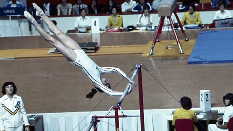 Gymnast Nadia Comaneci on the uneven bars, a performance that was awarded a perfect 10 in the 1976 Olympic Games