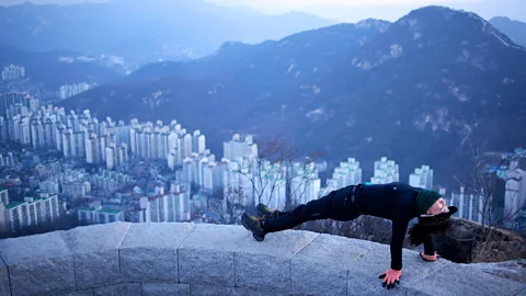 Ed Jones/Getty Seoul starts moving early in the day (Credit: Ed Jones/Getty)