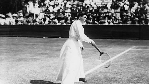 Black-and-white photograph of tennis player Charlotte Cooper, playing at Wimbledon around the turn of the 20th century