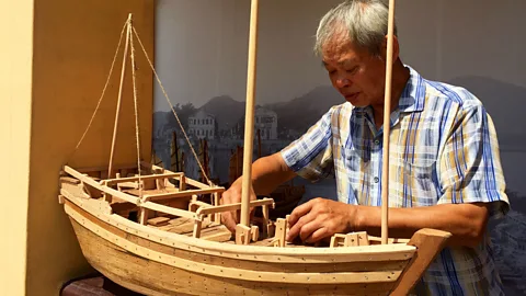 Kate Springer Wan Chun meticulously crafts a replica ship (Credit: Kate Springer)