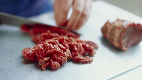 Science Photo Library If you chop meat on a chopping board you should wash it right away (Credit: Science Photo Library)