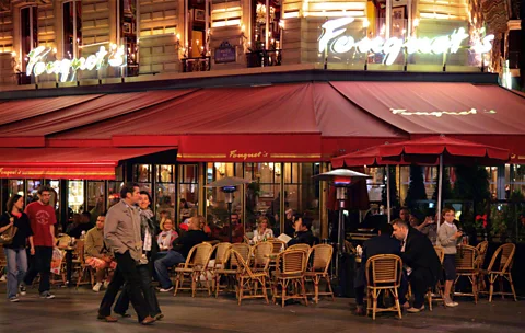 Peter Phipp/Travelshots.com/Alamy Restaurants along the Champs-Élysées (Credit: Peter Phipp/Travelshots.com/Alamy)
