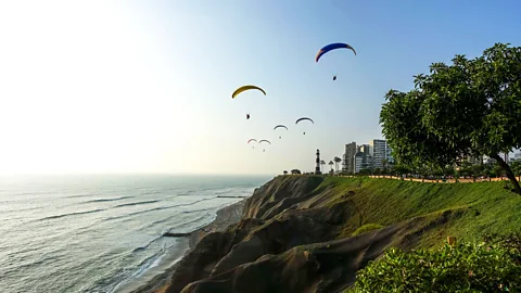 Caleo Photos/Alamy Paragliding off the coast of Miraflores in Lima (Credit: Caleo Photos/Alamy)