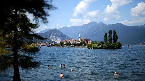 Gabriel Bouys/Getty Swimming in Lake Maggiore, an Italian favourite for a local holiday (Credit: Gabriel Bouys/Getty)