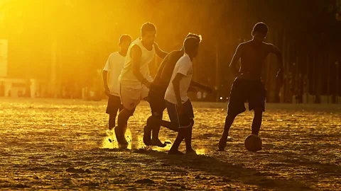 Ronaldo Schemidt/Getty Playing football on a beach in Santos (Credit: Ronaldo Schemidt/Getty)