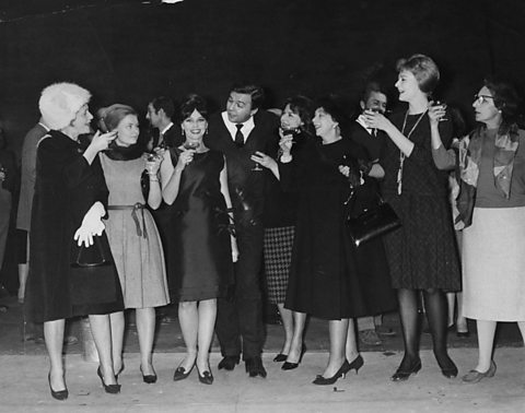 The Royal Shakespeare Company, including Judi Dench (second on left), share a toast in 1961