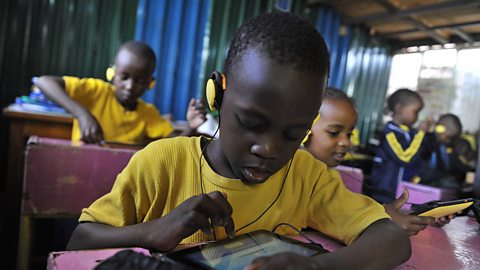 Children in Kenyan classroom using tablets for their lessons