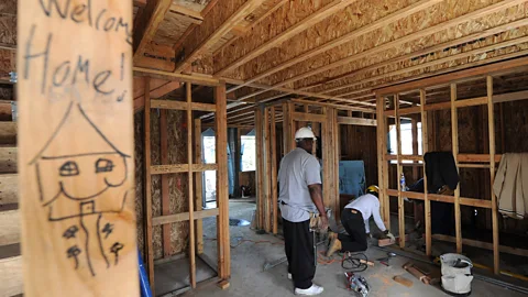 Getty Images/AFP Nonprofit, Habitat for Humanity volunteers build environmentally friendly homes for low-income families in Lynwood, California. (Credit: Getty Images/AFP)